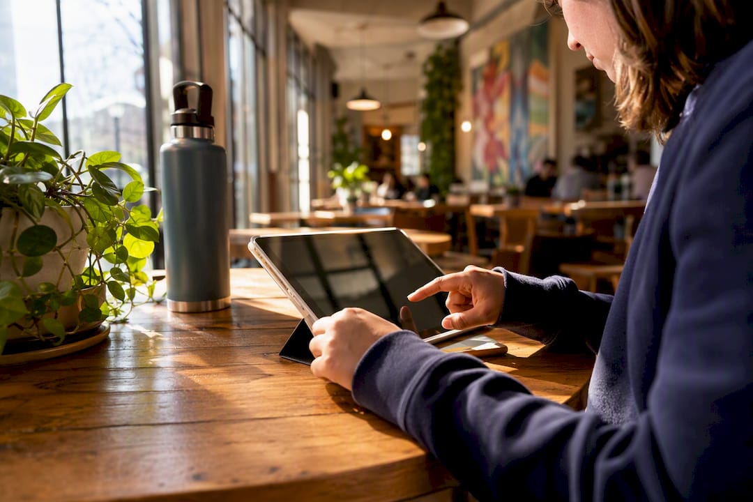 Hands using no-code app on tablet
