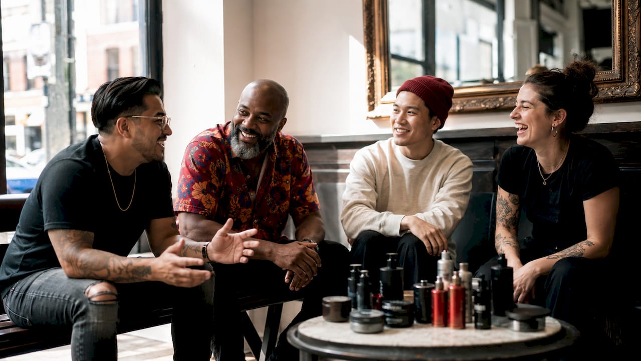 Group chatting while waiting in barbershop