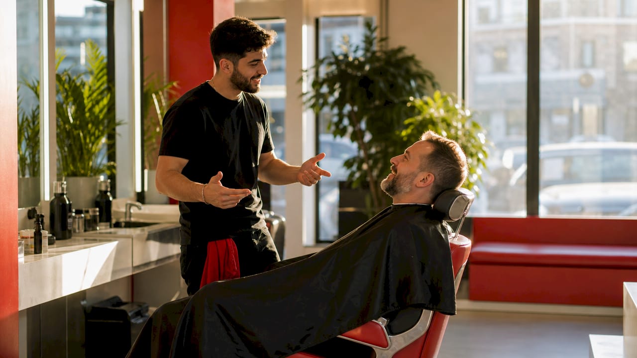 Barber and customer consultation in barbershop