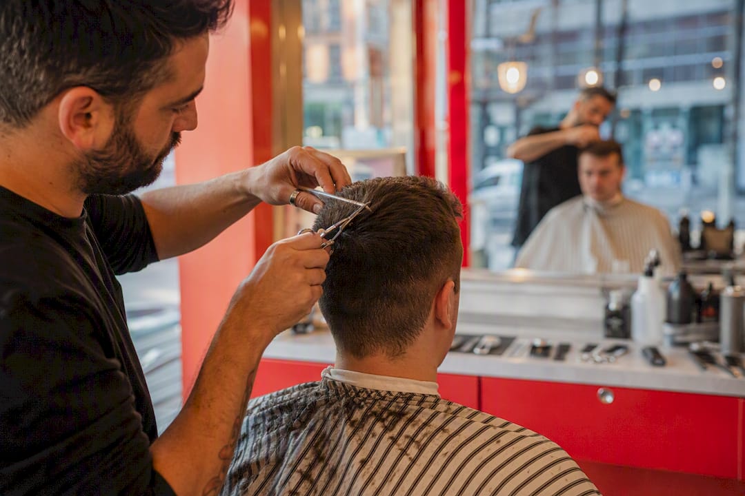 Barber tapering Ivy League haircut