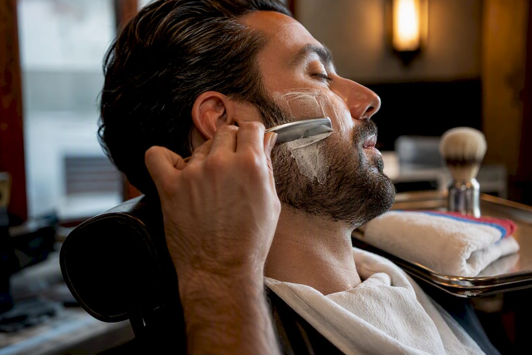 Barber performing a careful wet shave