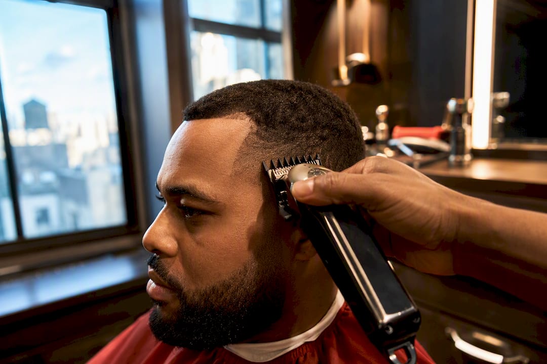 Barber shaping a receding hairline