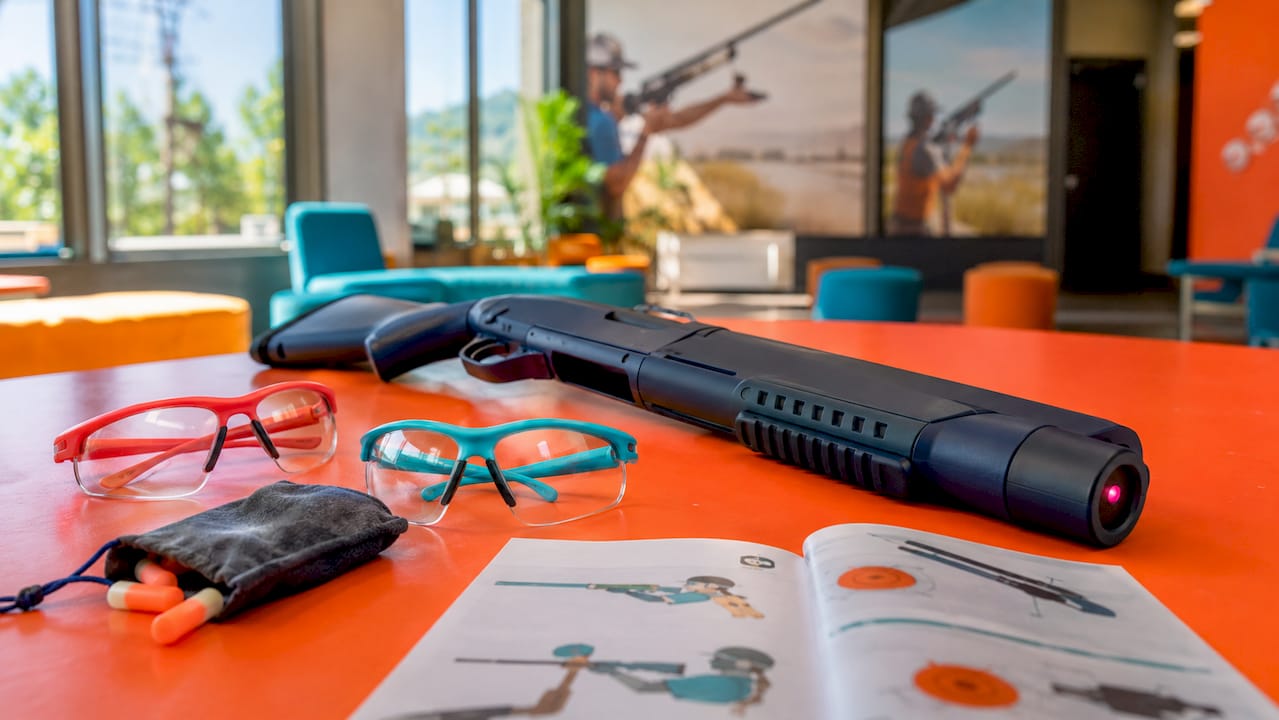 Close-up of laser clay shooting gear on table