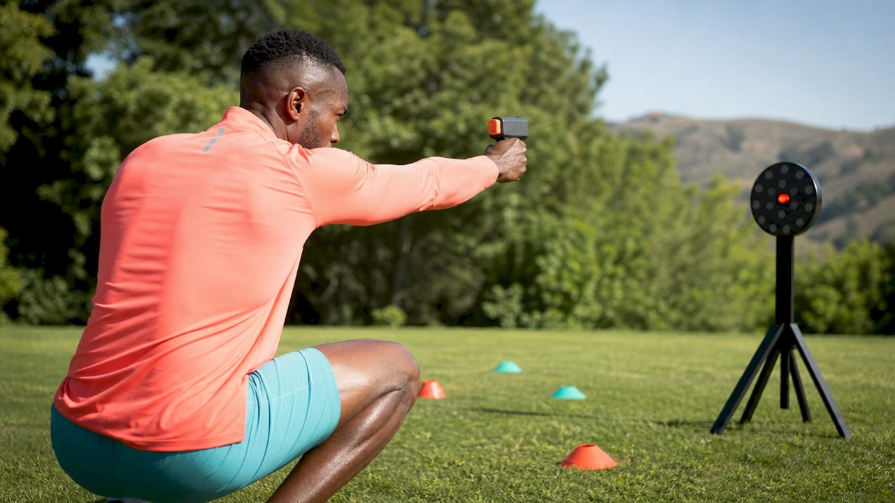 Athlete training with laser target indoors