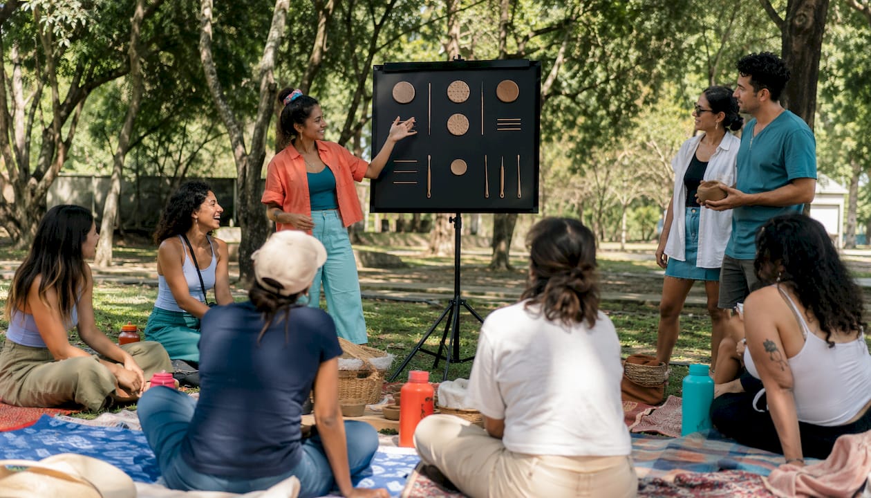 Instructor showing inclusive scoring to laser clay group