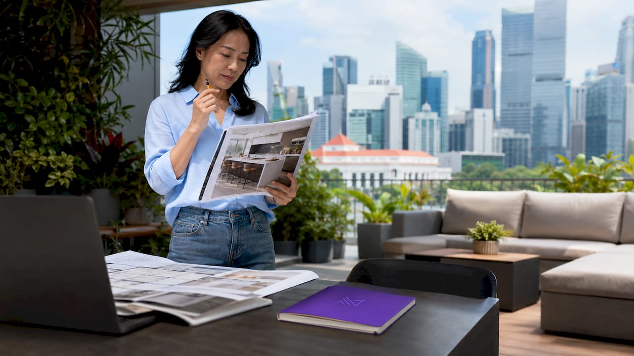 Woman assessing modern kitchen island layout
