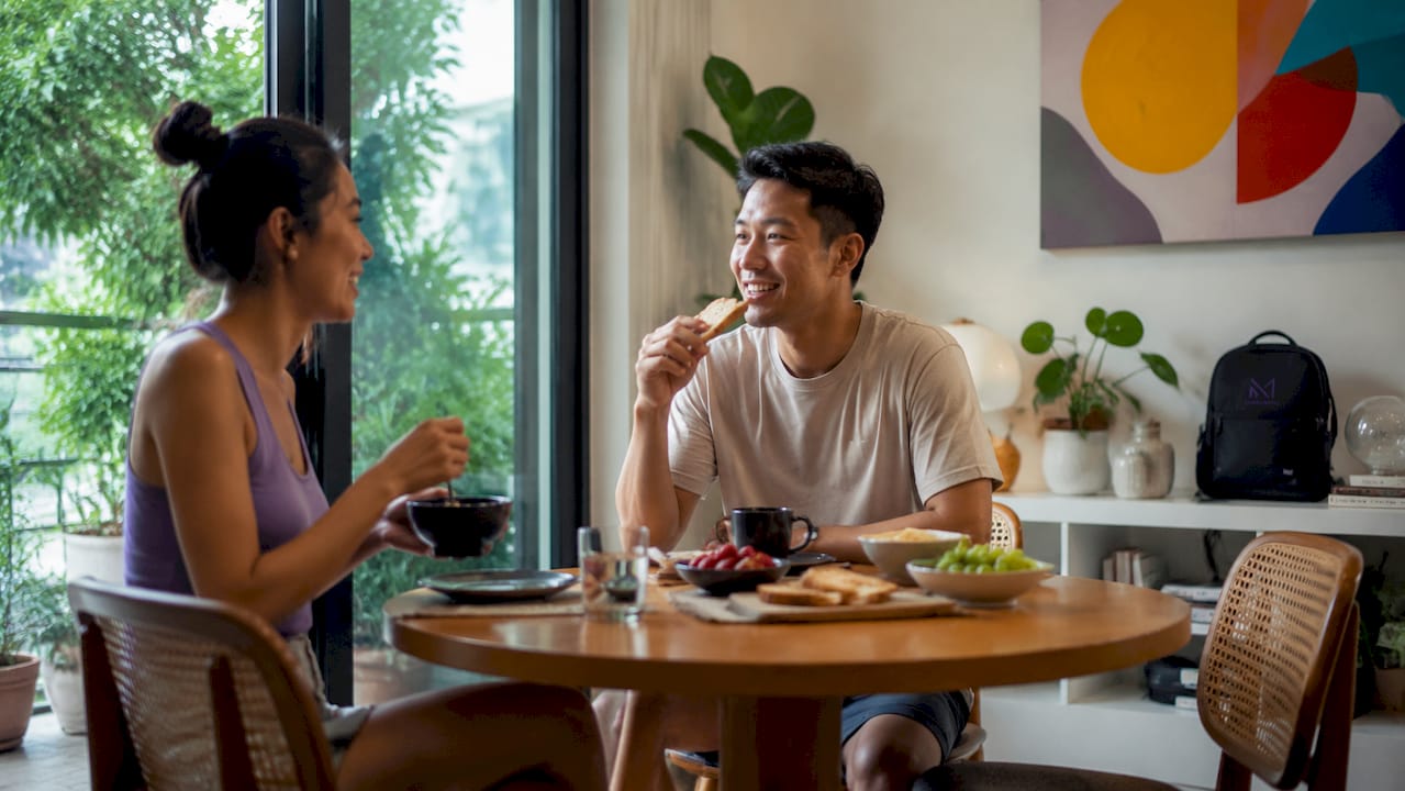 Family dining in open-plan Singapore living room
