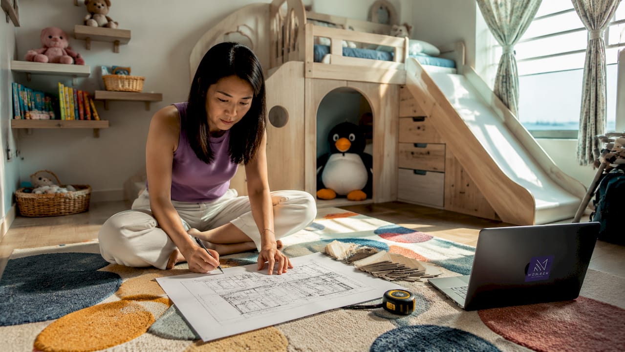 Asian mother reviewing kids room carpentry plan