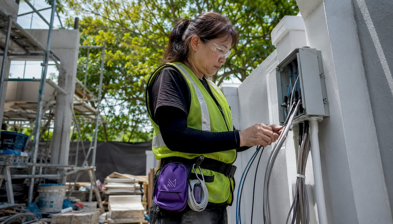 Singapore Asian electrician installing smart home wiring
