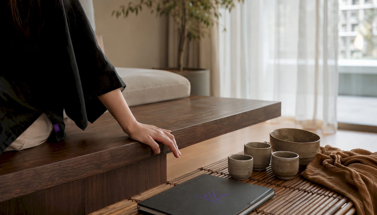 Hand touching wood in Japandi living room