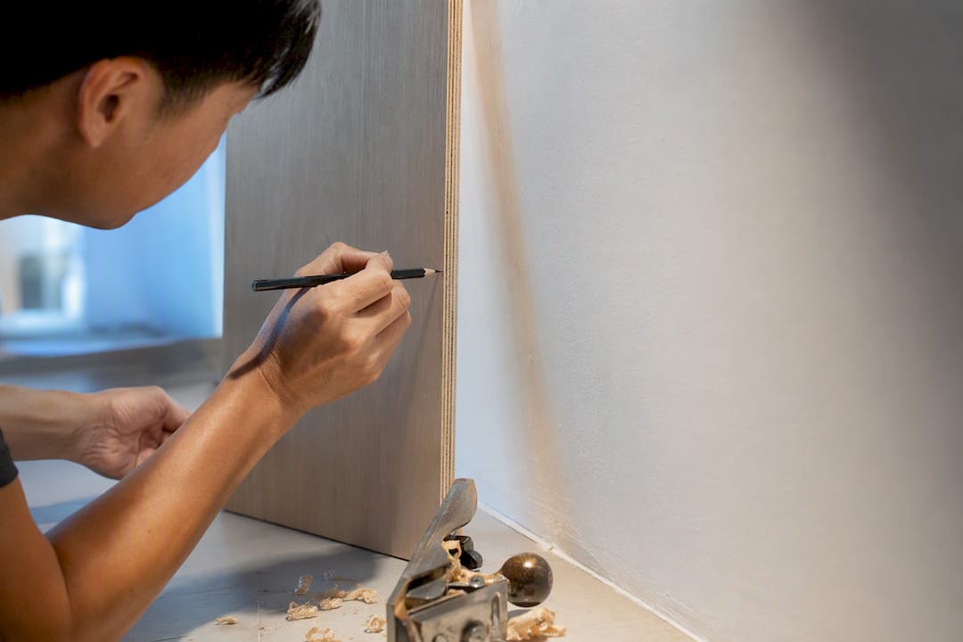 Carpenter scribing panel to uneven wall