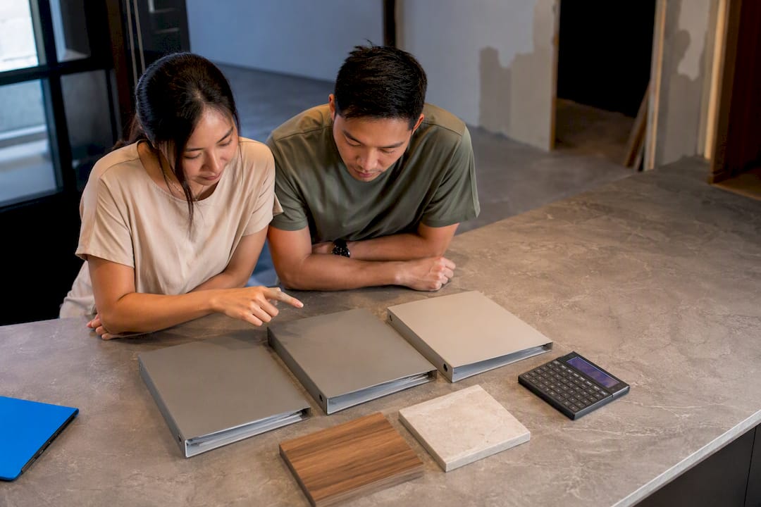 Singaporean couple comparing renovation bids