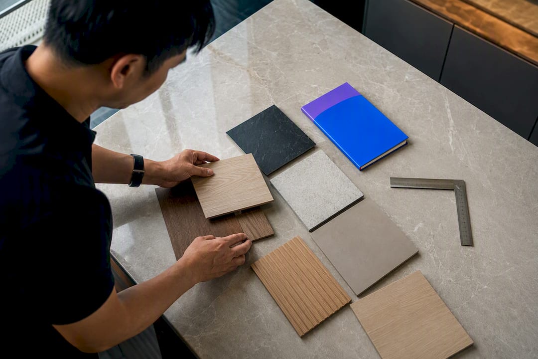 Singapore homeowner comparing renovation material samples