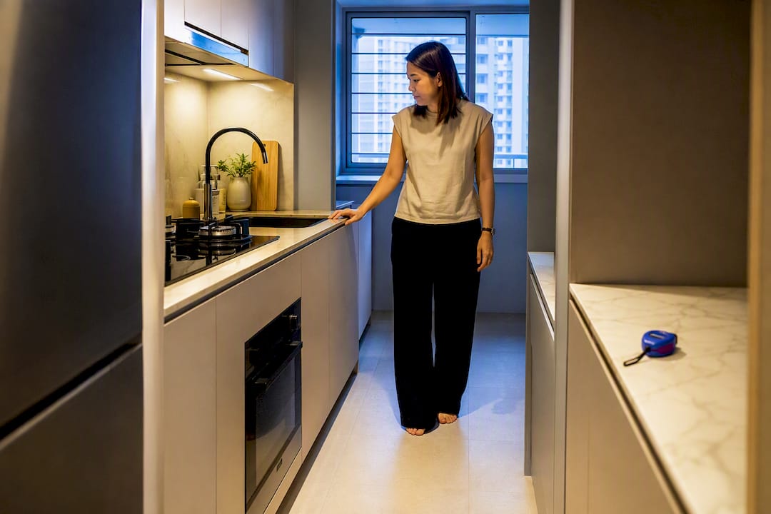 Singapore homeowner in renovated galley kitchen