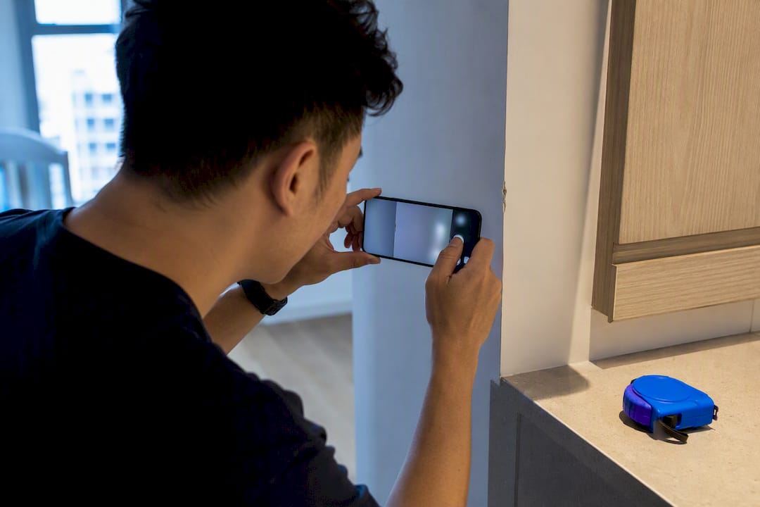 Supervisor documenting renovation finishing defect