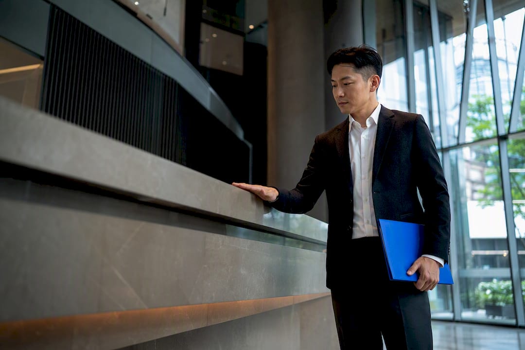 Singapore Asian project lead reviewing reception counter