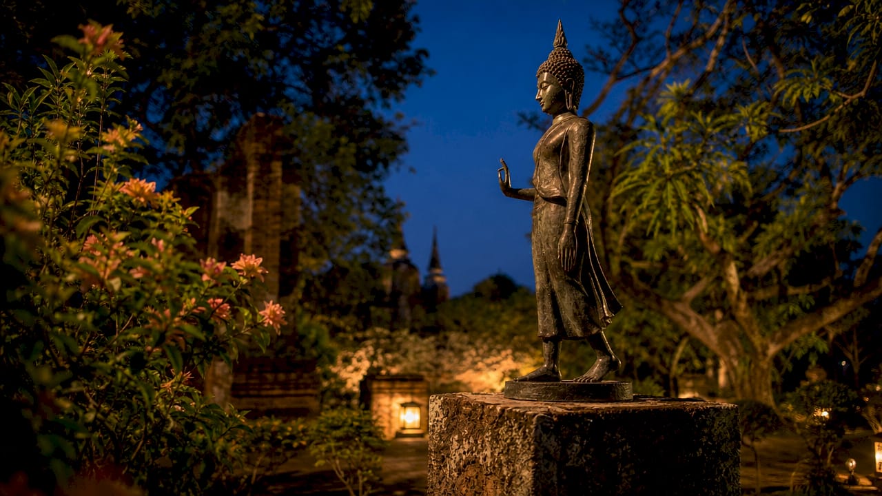 Sukhothai bronze Walking Buddha sculpture close-up