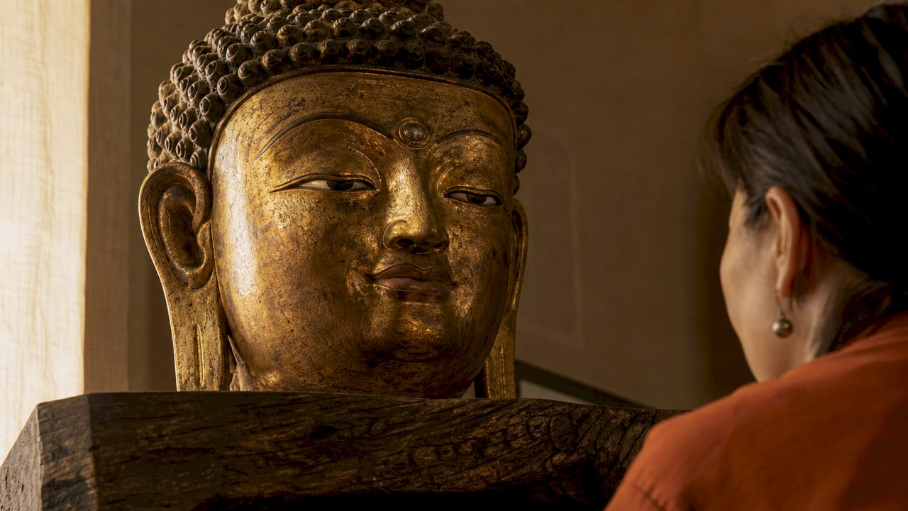 Gilded bronze Buddha head urna close-up