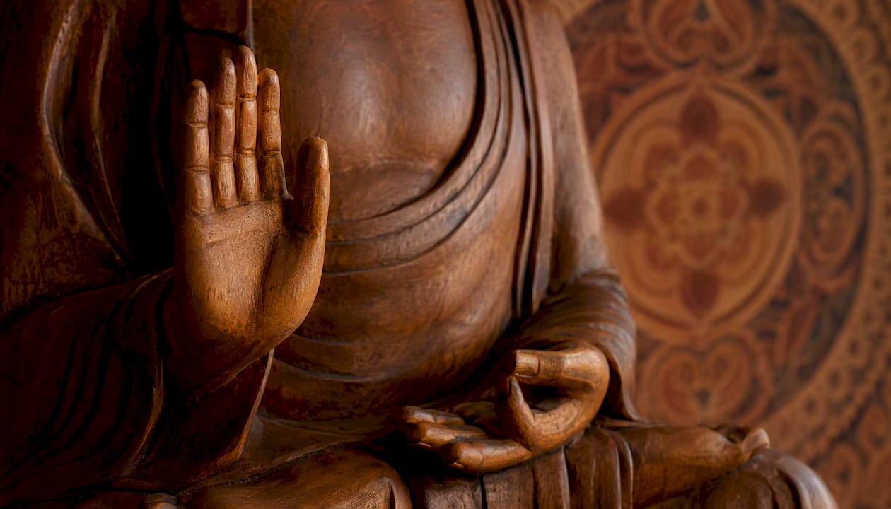 Close-up of Buddha statue hand mudras