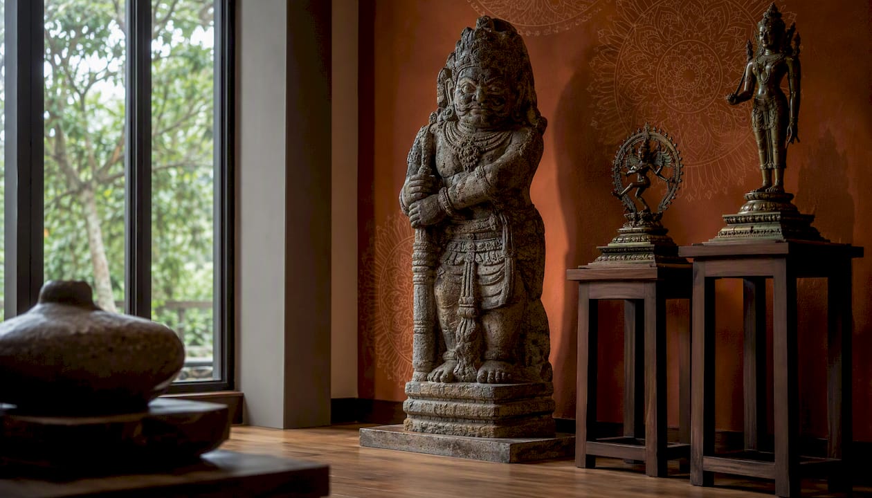 Gallery display of Indonesian temple statues with labels