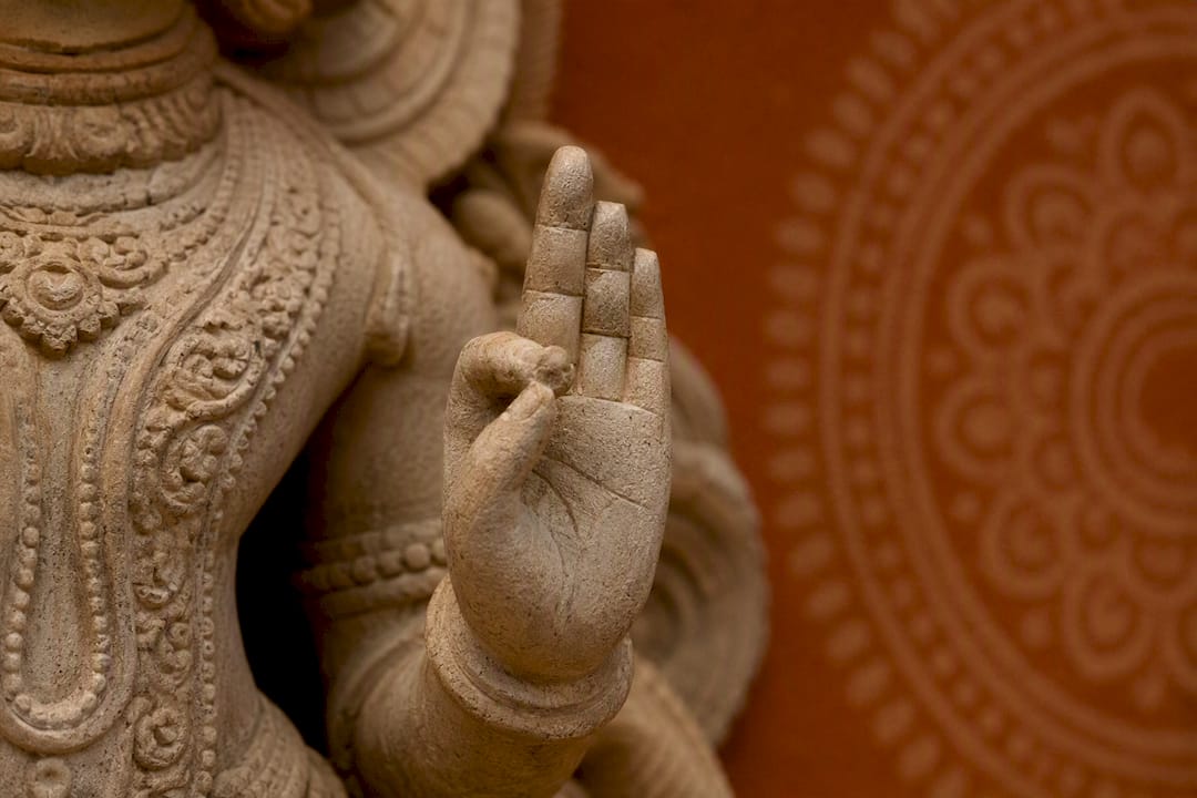 Close-up of Hindu deity sculpture hand gesture