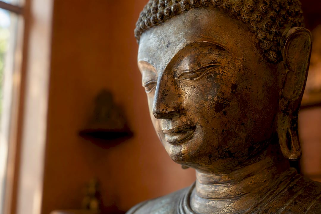 Close-up of bronze Buddha statue detail