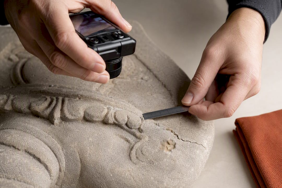 Documenting a crack on a stone carving