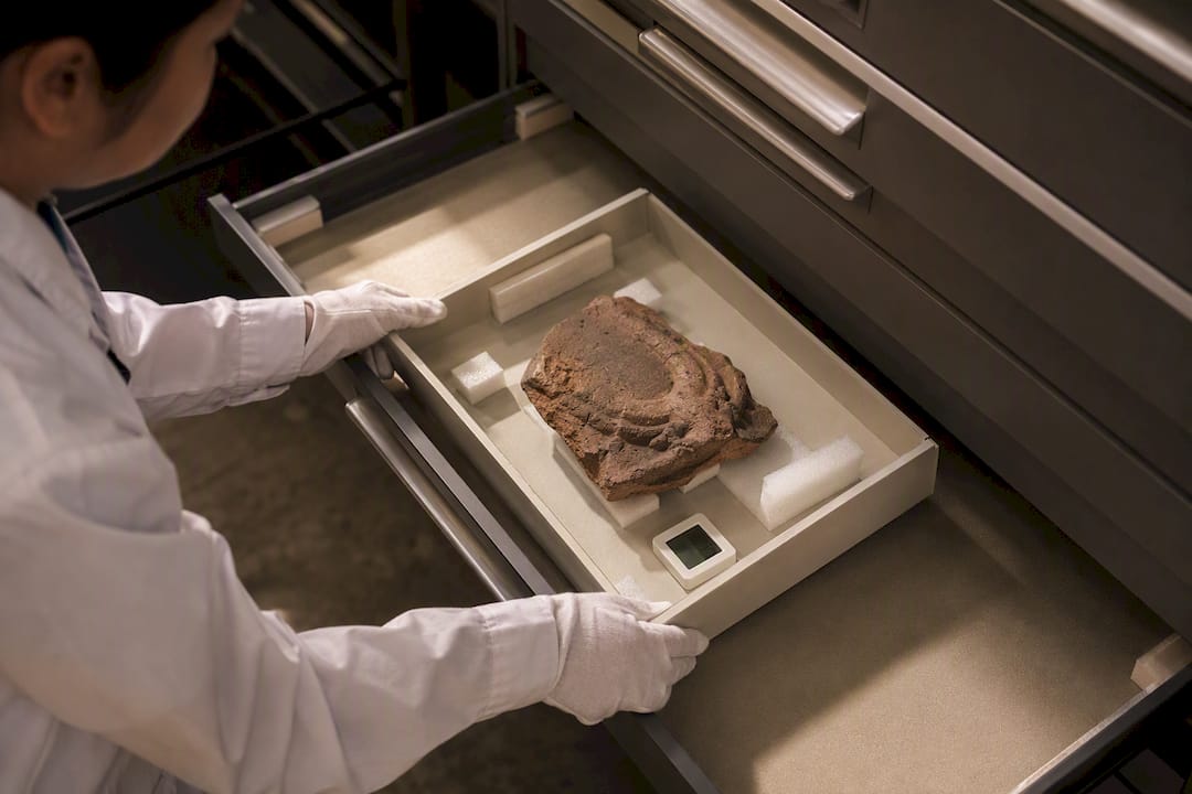 Porous terracotta fragment in museum storage
