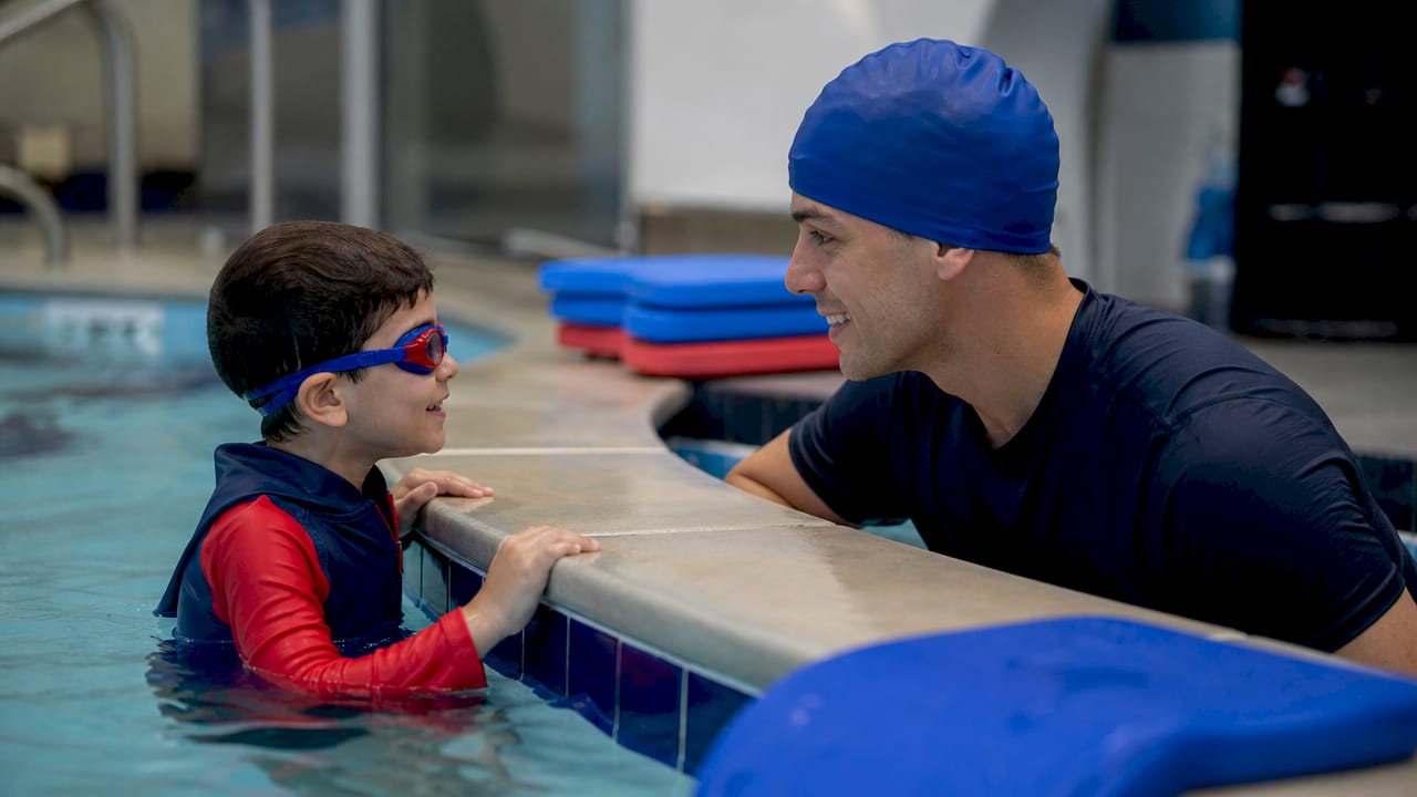 Child receiving one-on-one swim instruction