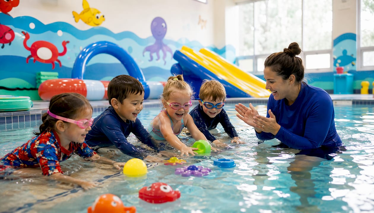 Children playing water games with instructor outdoors