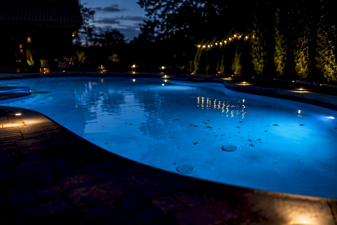 Underwater and deck lighting enhancing nighttime pool safety