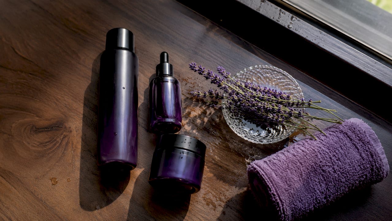 Flat lay of Korean skincare products with aloe and towel