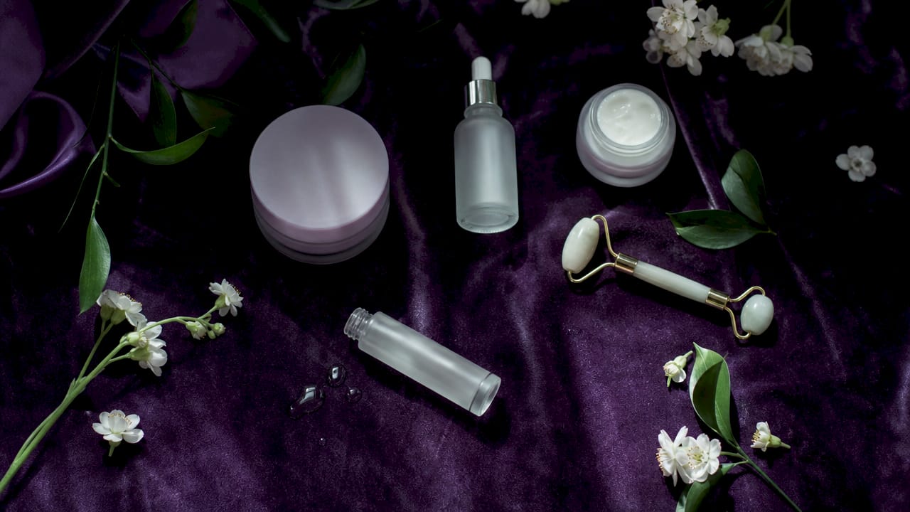 Flat lay of Korean skincare products including essence