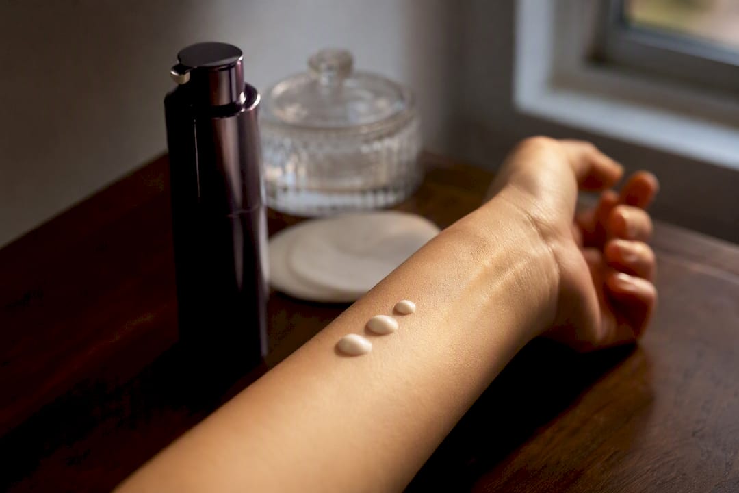 Airless skincare pump and skin texture close-up