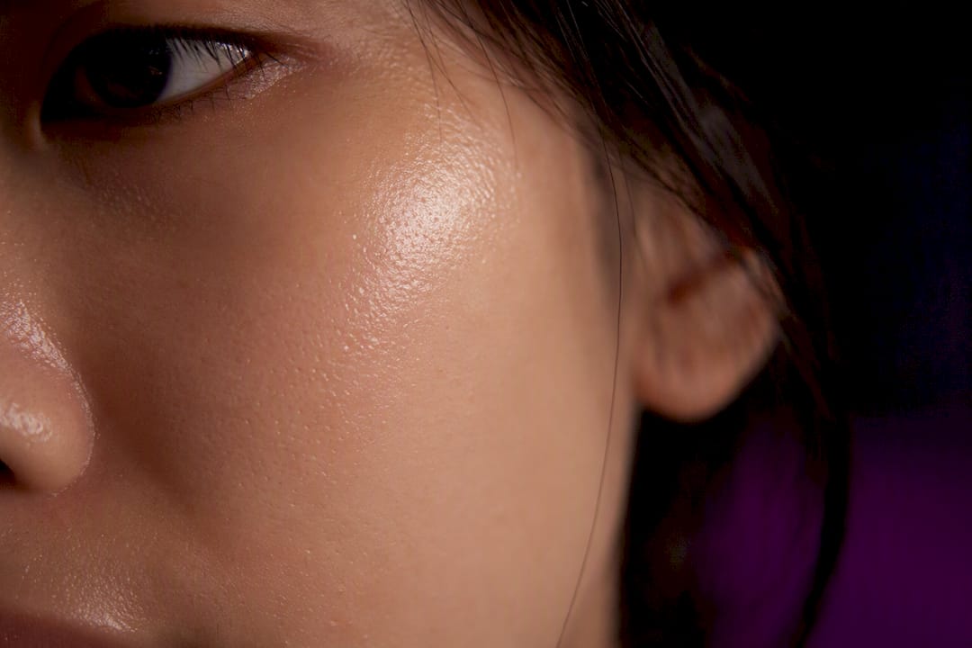 Close-up of hydrated skin texture with glowing moisture