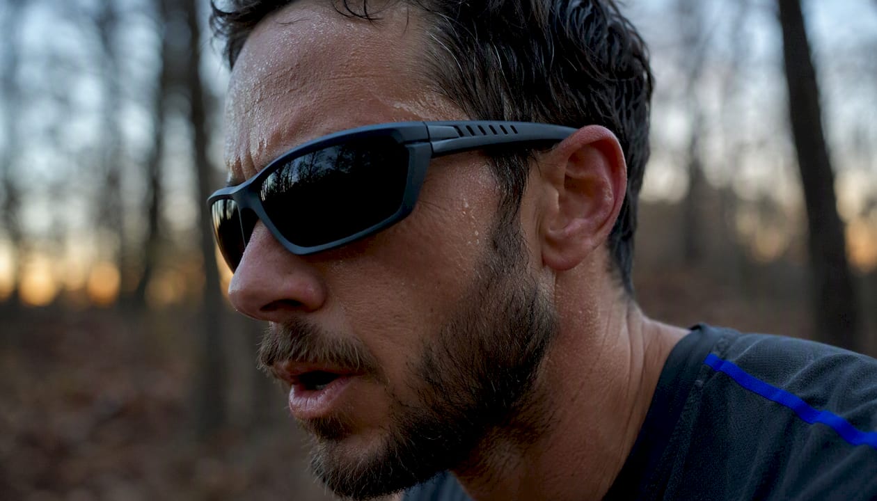 Side profile of runner wearing ventilated sport sunglasses