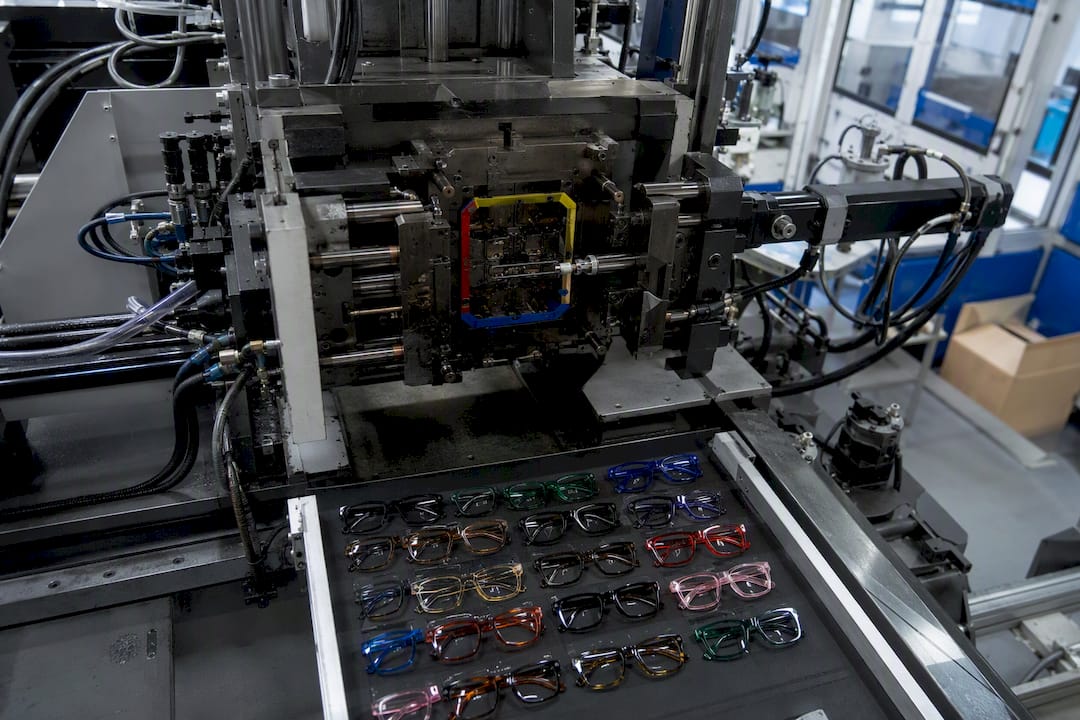 Injection molding machine shaping nylon frames