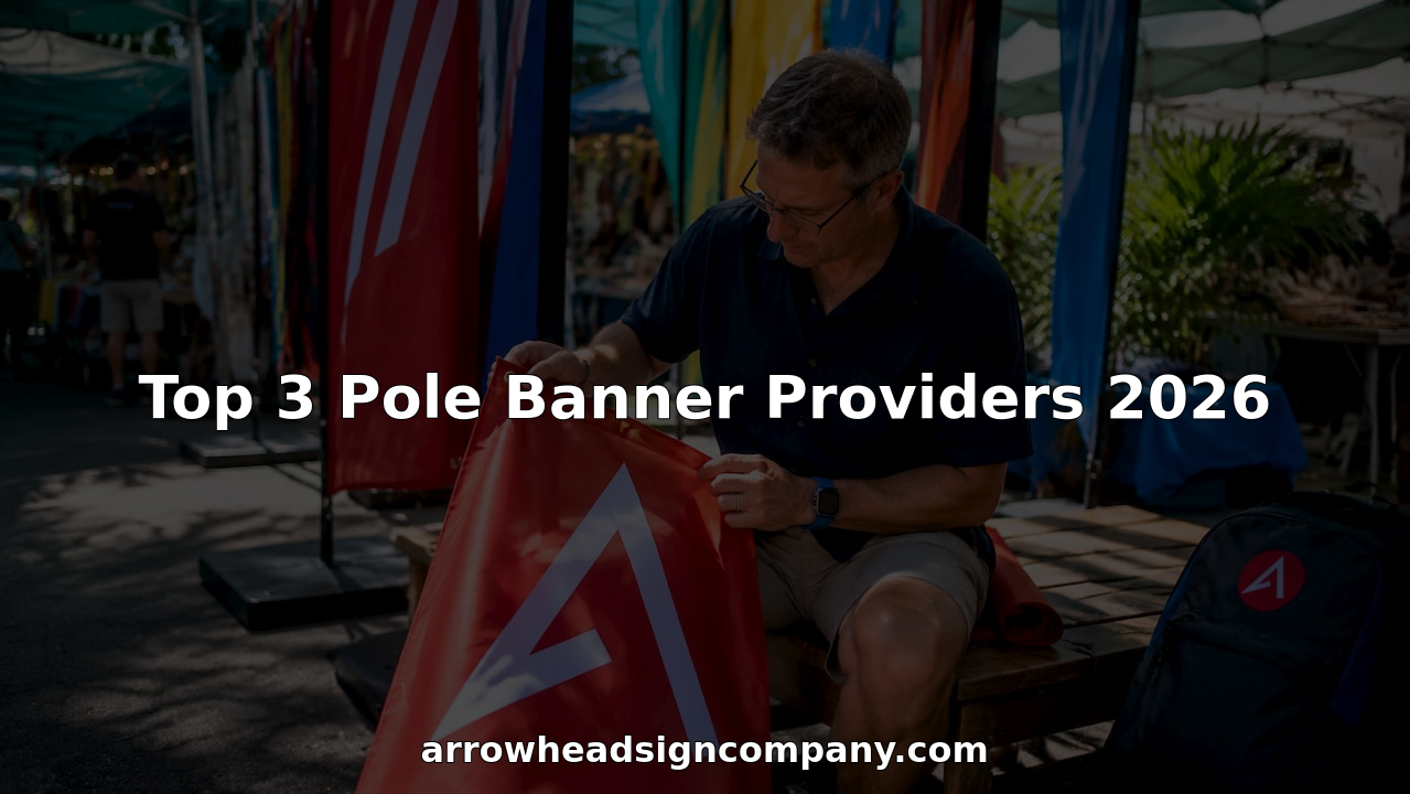 Technician inspecting printed pole banners in workshop
