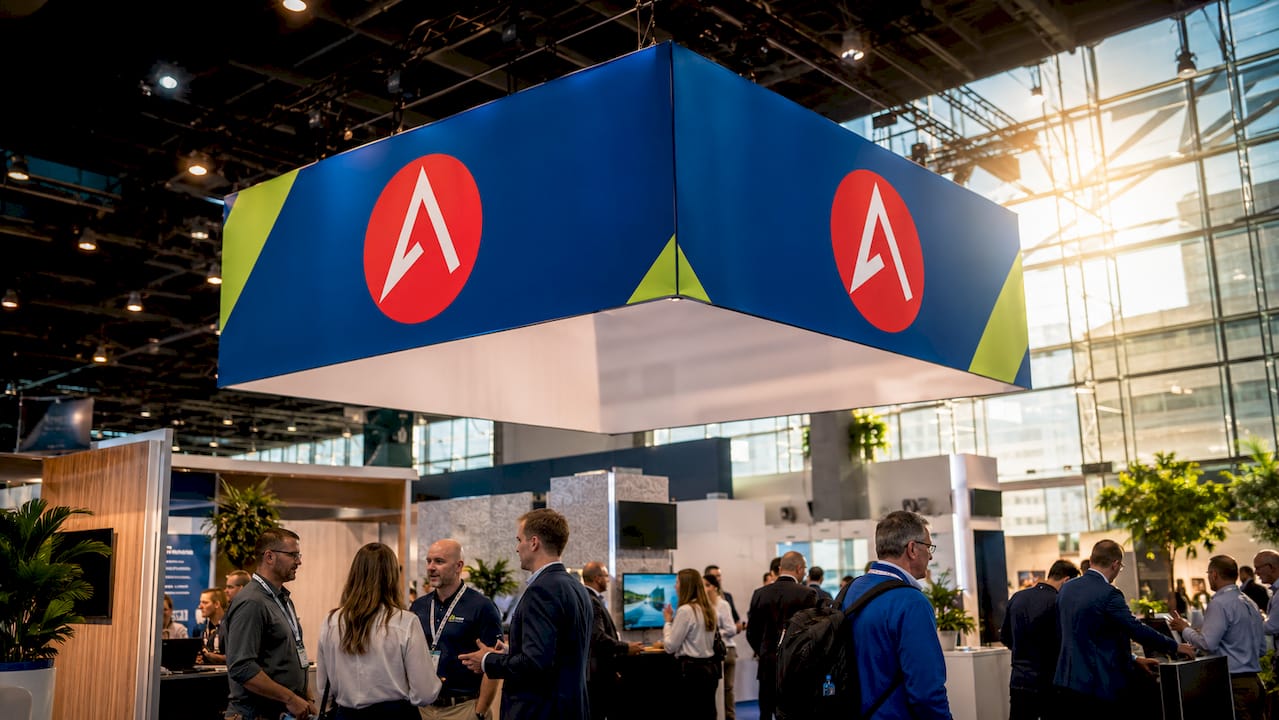 Trade show floor with hanging fabric display overhead