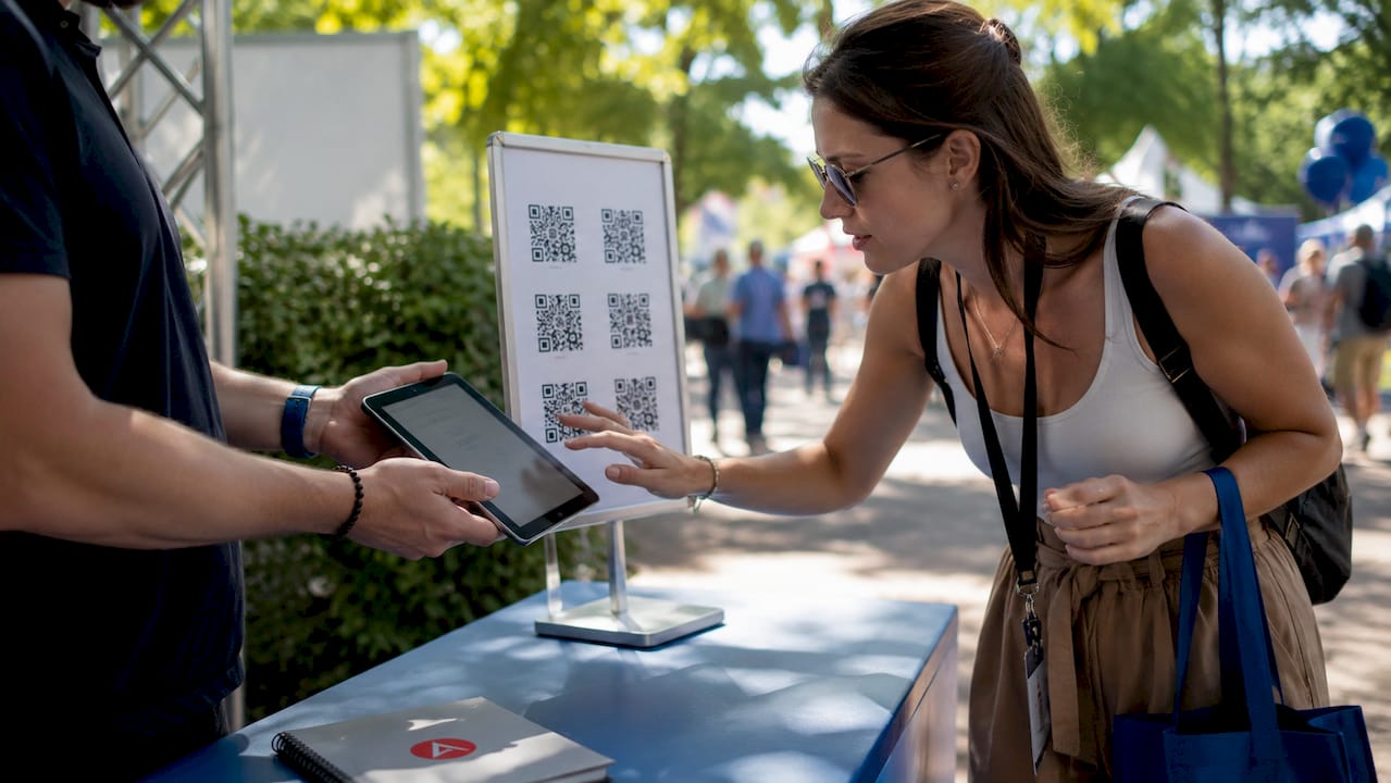 Attendee scanning QR code at trade show booth