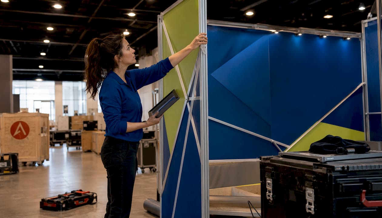 Woman adjusting fast trade show booth frame