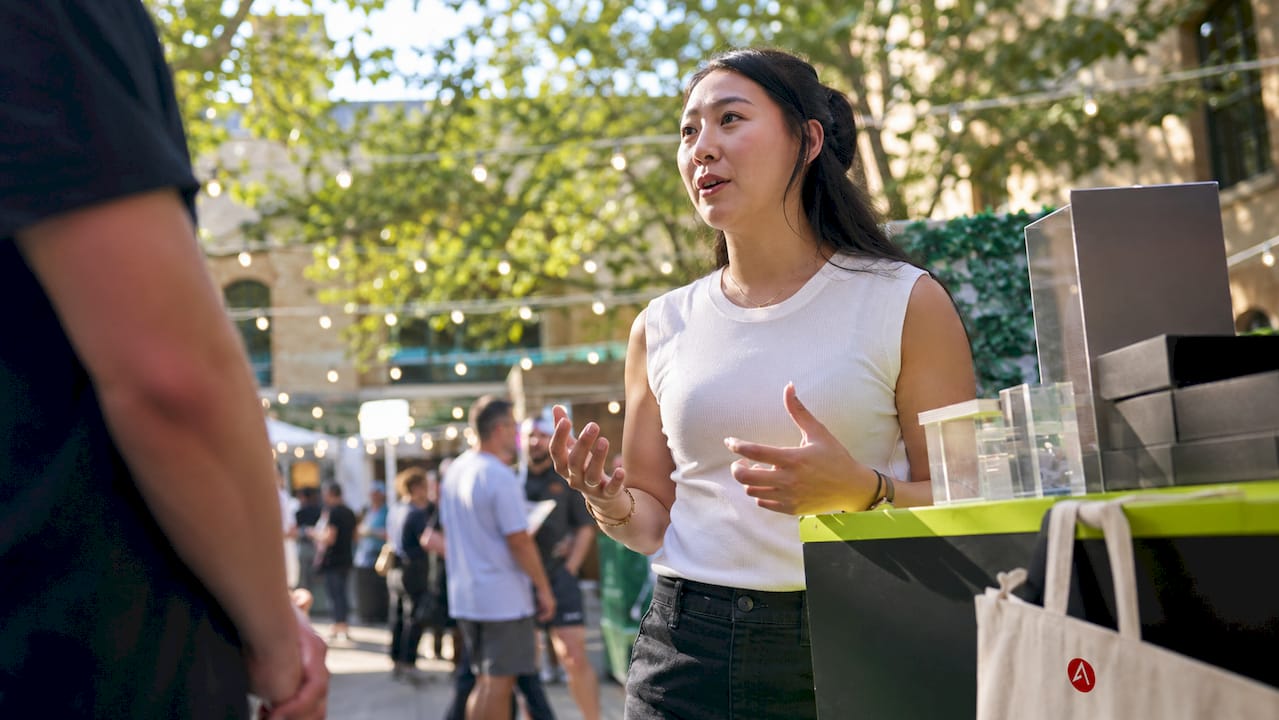 Presenter interacting at hyper-experiential booth