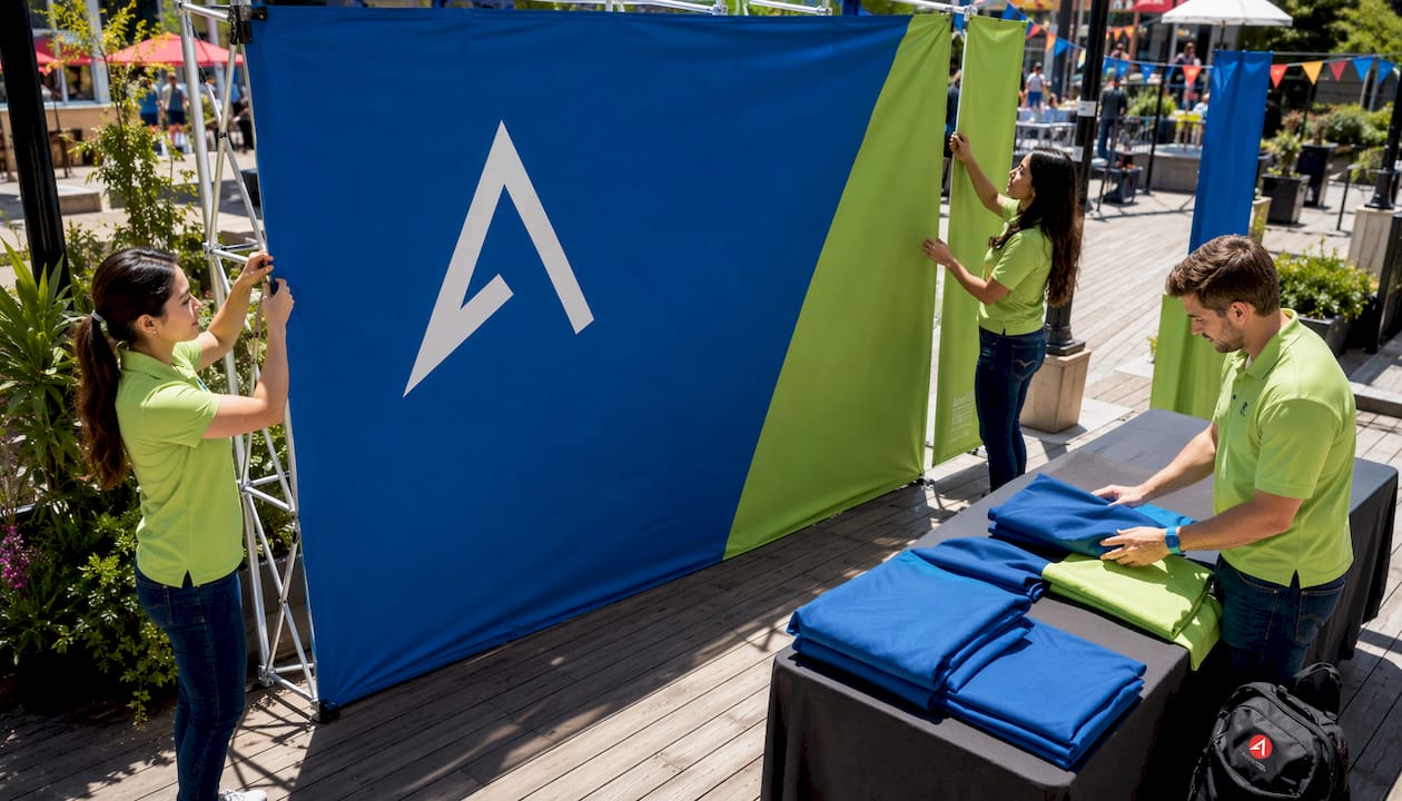 Small team assembling pop-up trade show booth