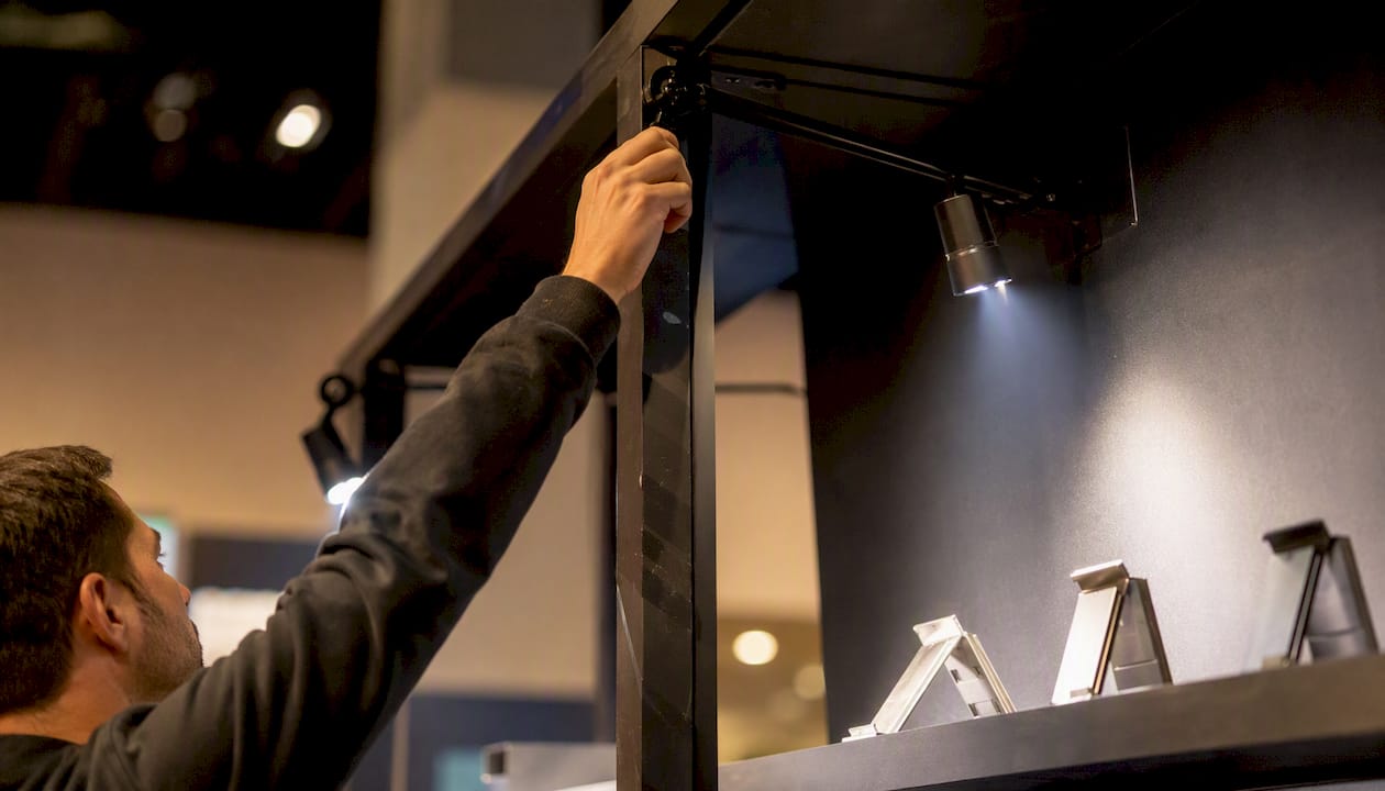 LED arm lights focused on product display shelf