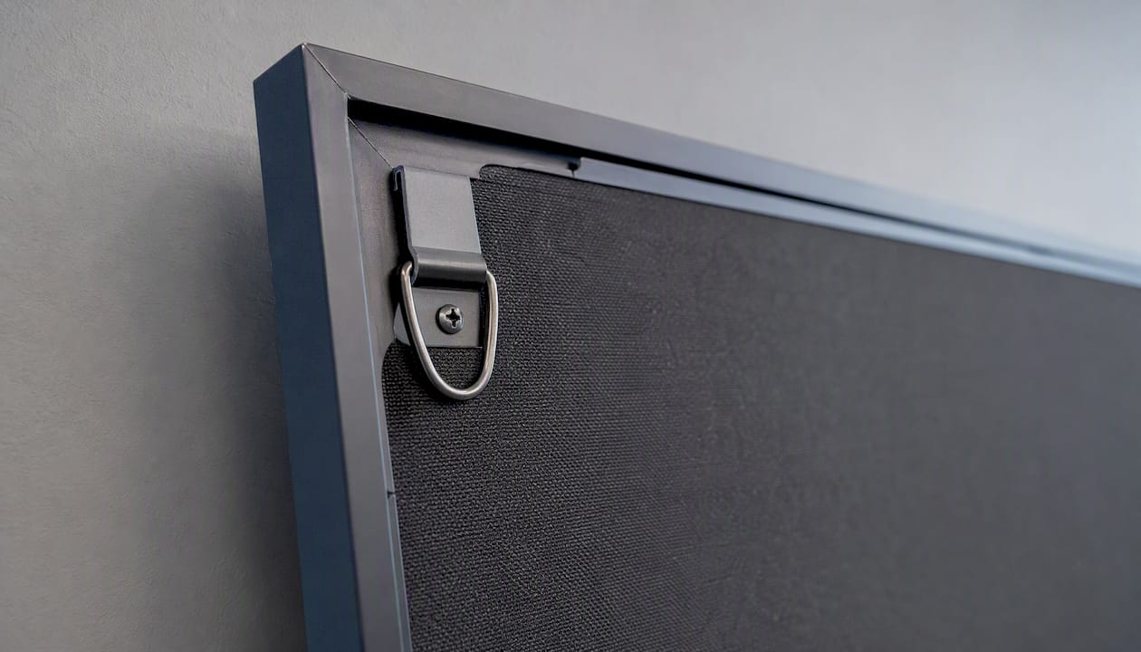 Sawtooth hanger and mounting hardware on mounted print