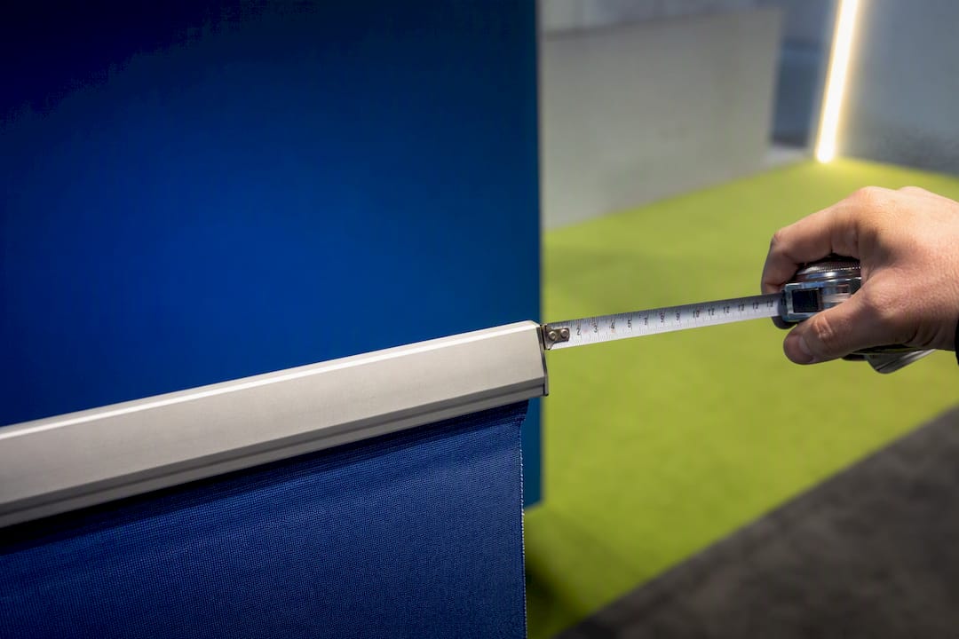 Measuring tape beside cropped banner bar