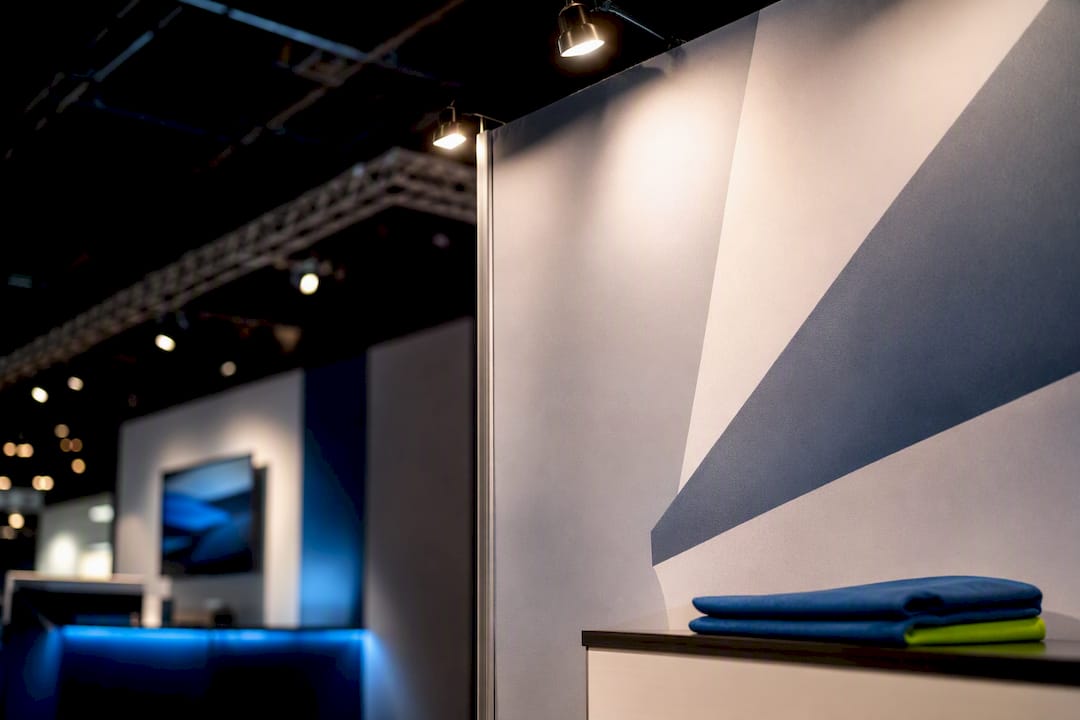 Compact trade show booth under focused lighting