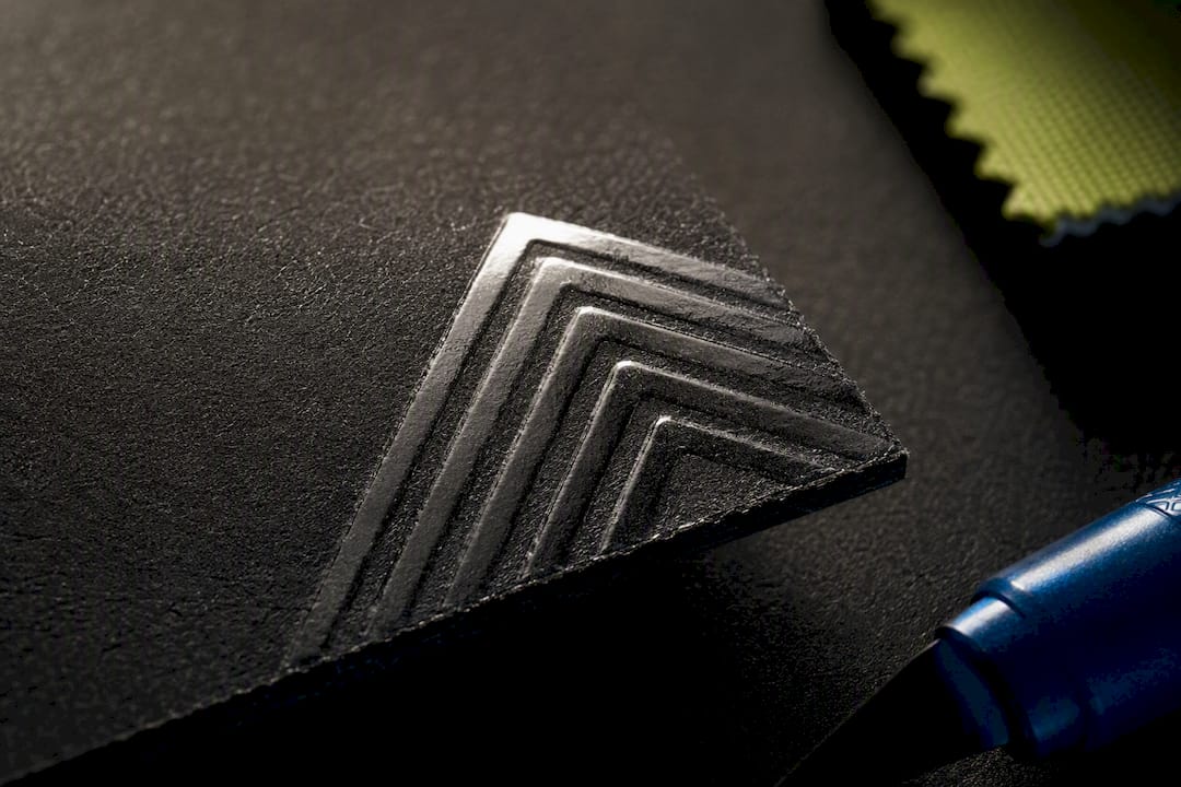 Raised spot UV coating on card corner