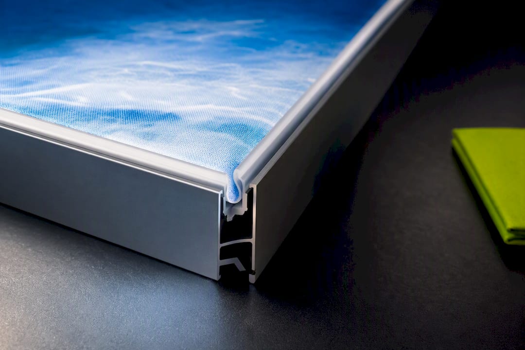 Illuminated SEG frame and fabric edge