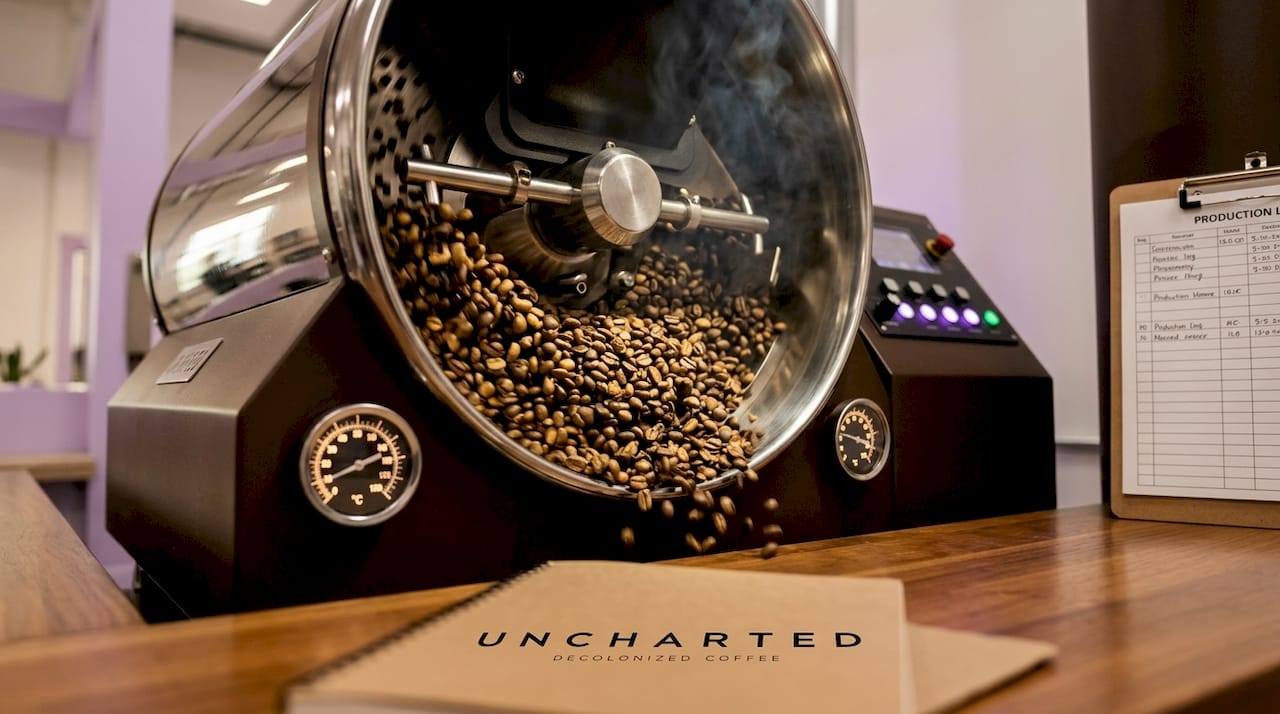 Close-up of coffee beans roasting inside drum machine
